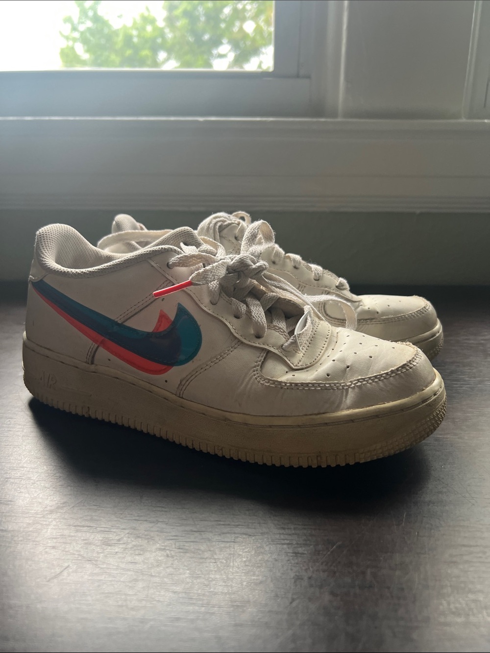 Nike White Low-Top Sneakers with Blue and Red Swoosh
